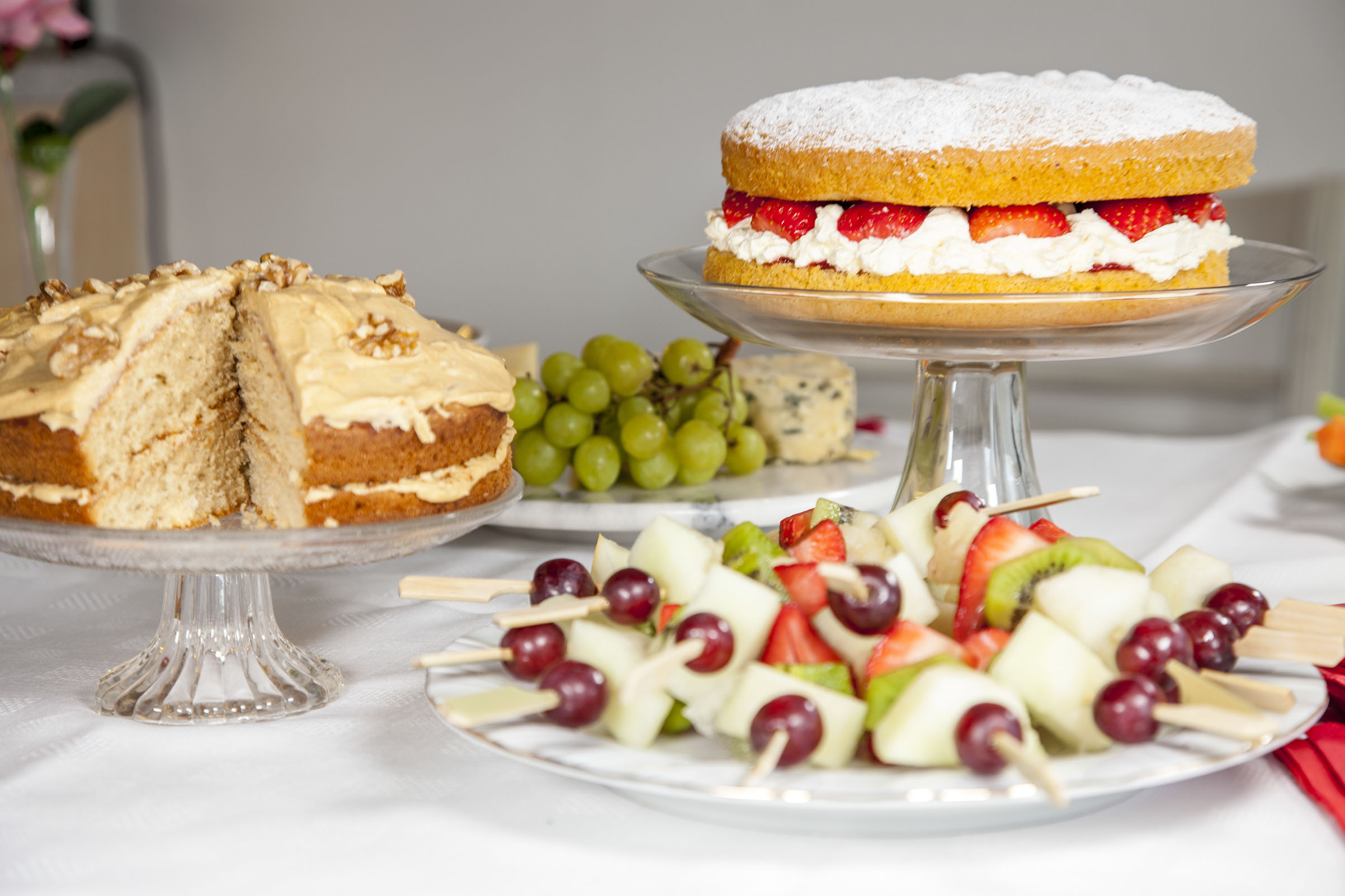 Fruit kebabs and cake display